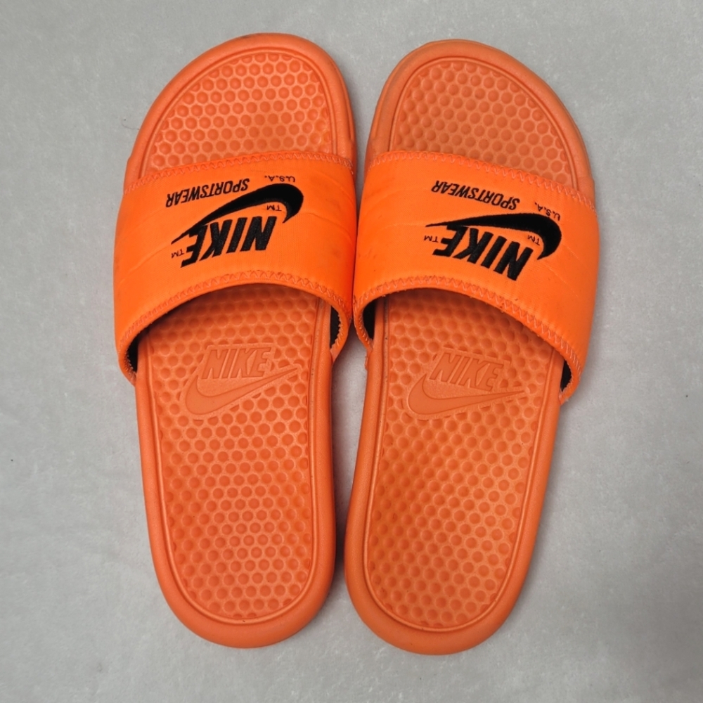 Orange nike slides